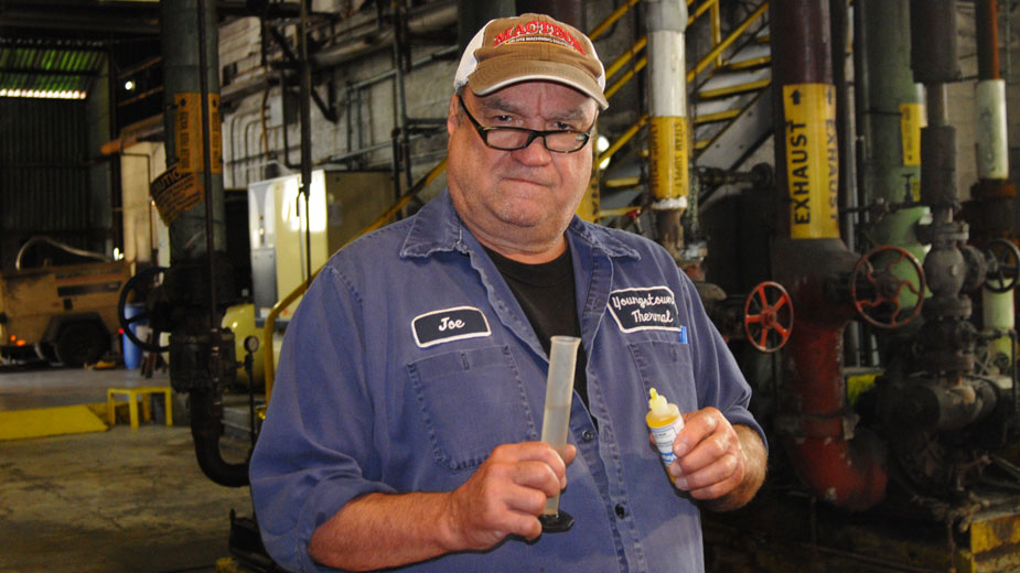Joe Firmstone tests a water sample at the Youngstown Thermal North Avenue plant.