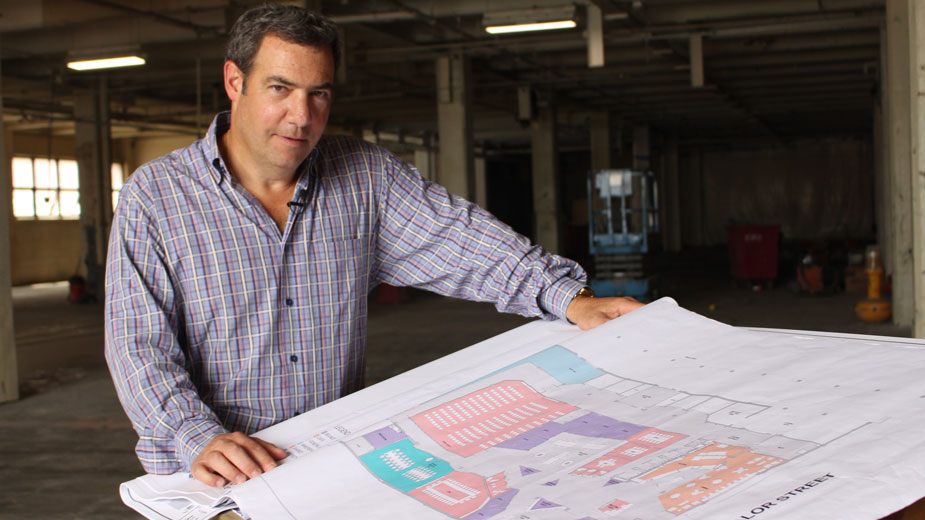 Douglas Weintraub, CEO of Bounce Innovation Hub, looks over plans for a $2.5 million renovation of the incubator