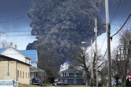 A black plume rises over East Palestine, Ohio, on Feb. 5, 2023, as a result of a controlled detonation of a portion of the derailed Norfolk Southern train. (AP Photo | Gene J. Puskar, File)