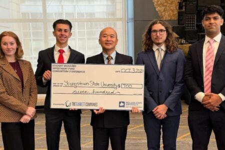 Alison Maring, James Kover, Simon Iwanonkiw, Zakria Chandio, all officers of the Student Investment Fund at Youngstown State University, and Peter Chen, associate professor in the Lariccia School of Accounting & Finance, faculty advisor (center), earned third place among 100 other universities in the Student Managed Investment Fund Consortium (SMIFC) held in Chicago, Illinois receiving $700.